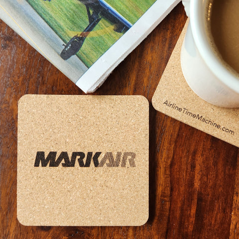 Image of cork coaster with Markair branding impression.