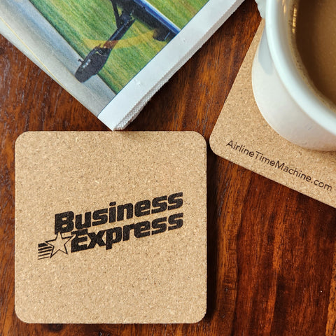 Image of cork coaster with Business Express Airlines branding impression.