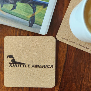 Image of cork coaster with Shuttle America branding impression.