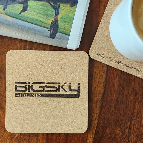Image of cork coaster with Big Sky Airlines branding impression.