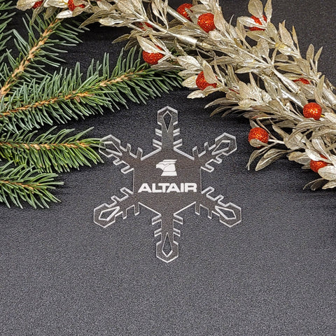 Image of acrylic snowflake ornament with Altair Airlines branding impression.