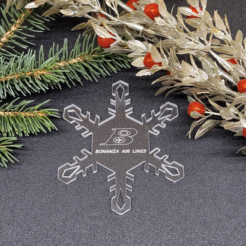 Image of acrylic snowflake ornament with Bonanza Airlines branding impression.