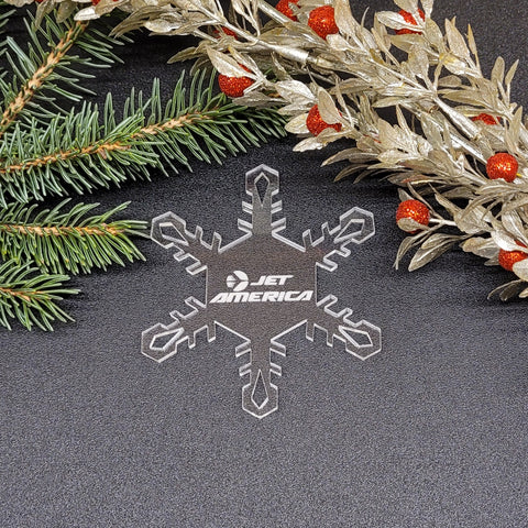 Image of acrylic snowflake ornament with Jet America Airlines branding impression.