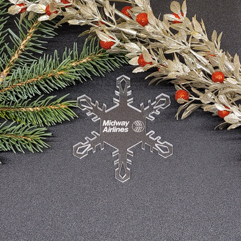 Image of acrylic snowflake ornament with Midway Airlines branding impression.