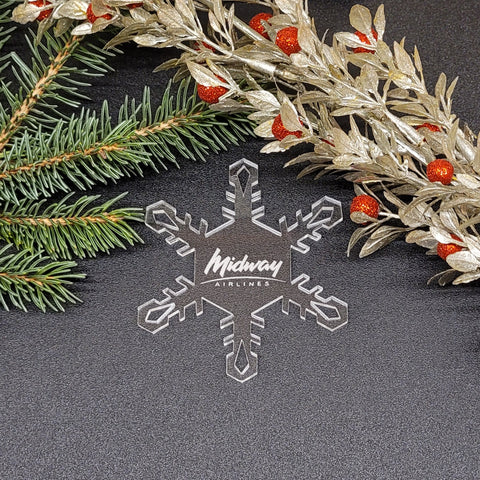 Image of acrylic snowflake ornament with Midway Airlines branding impression.