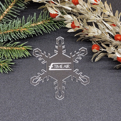 Image of acrylic snowflake ornament with Time Air branding impression.