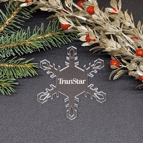 Image of acrylic snowflake ornament with TranStar Airlines branding impression.